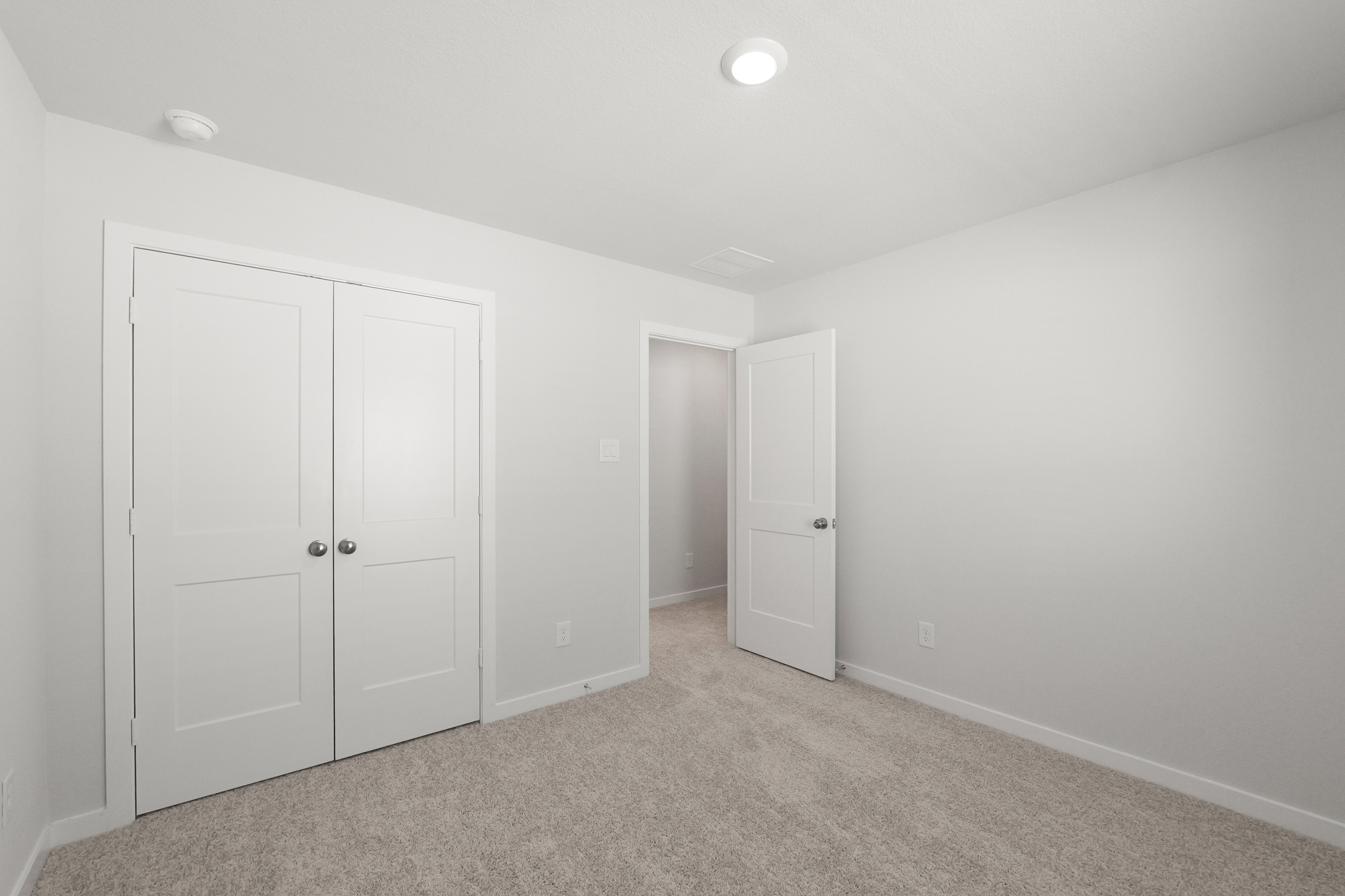 A room with white doors.