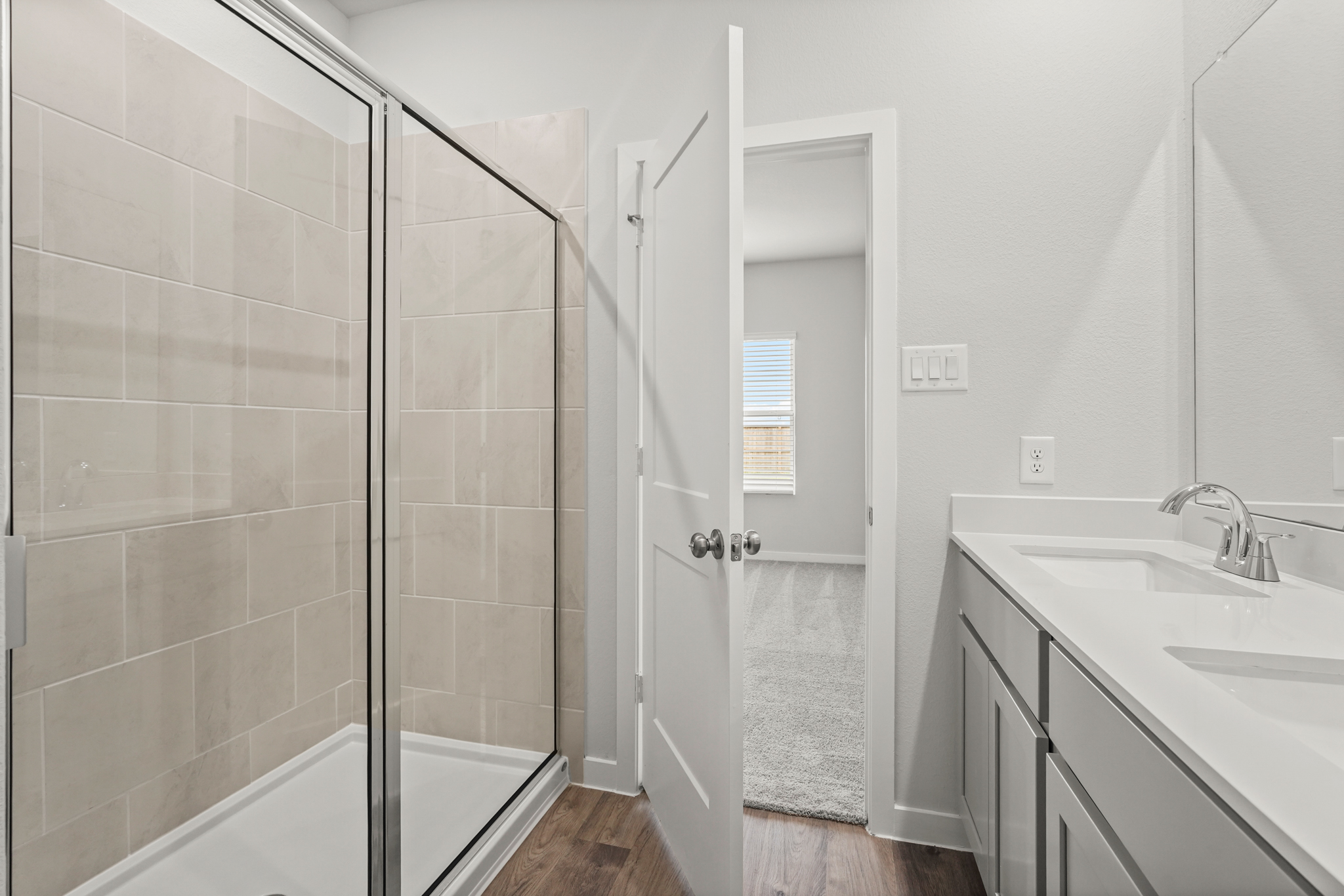 A bathroom with a glass shower.