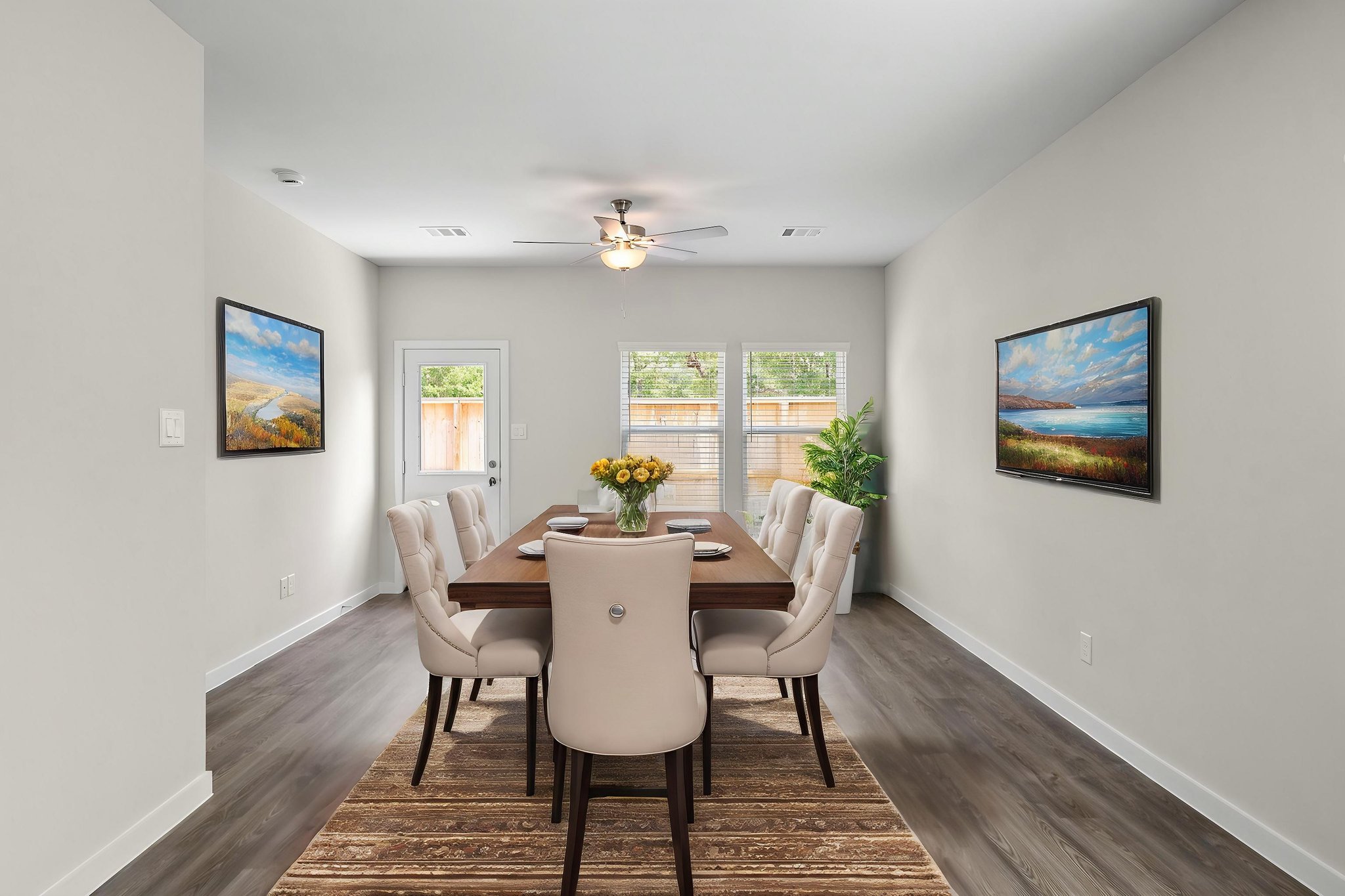 A dining room table with chairs.