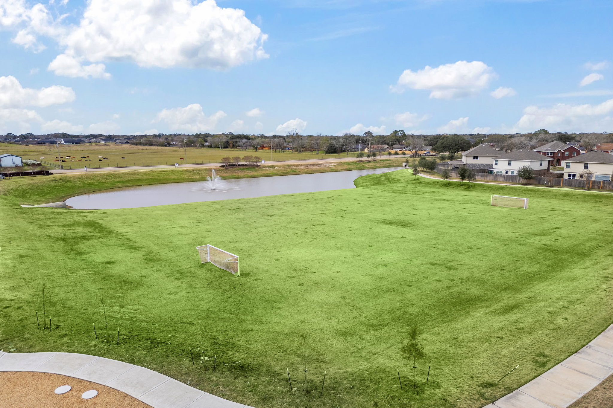 A golf course with a pond.