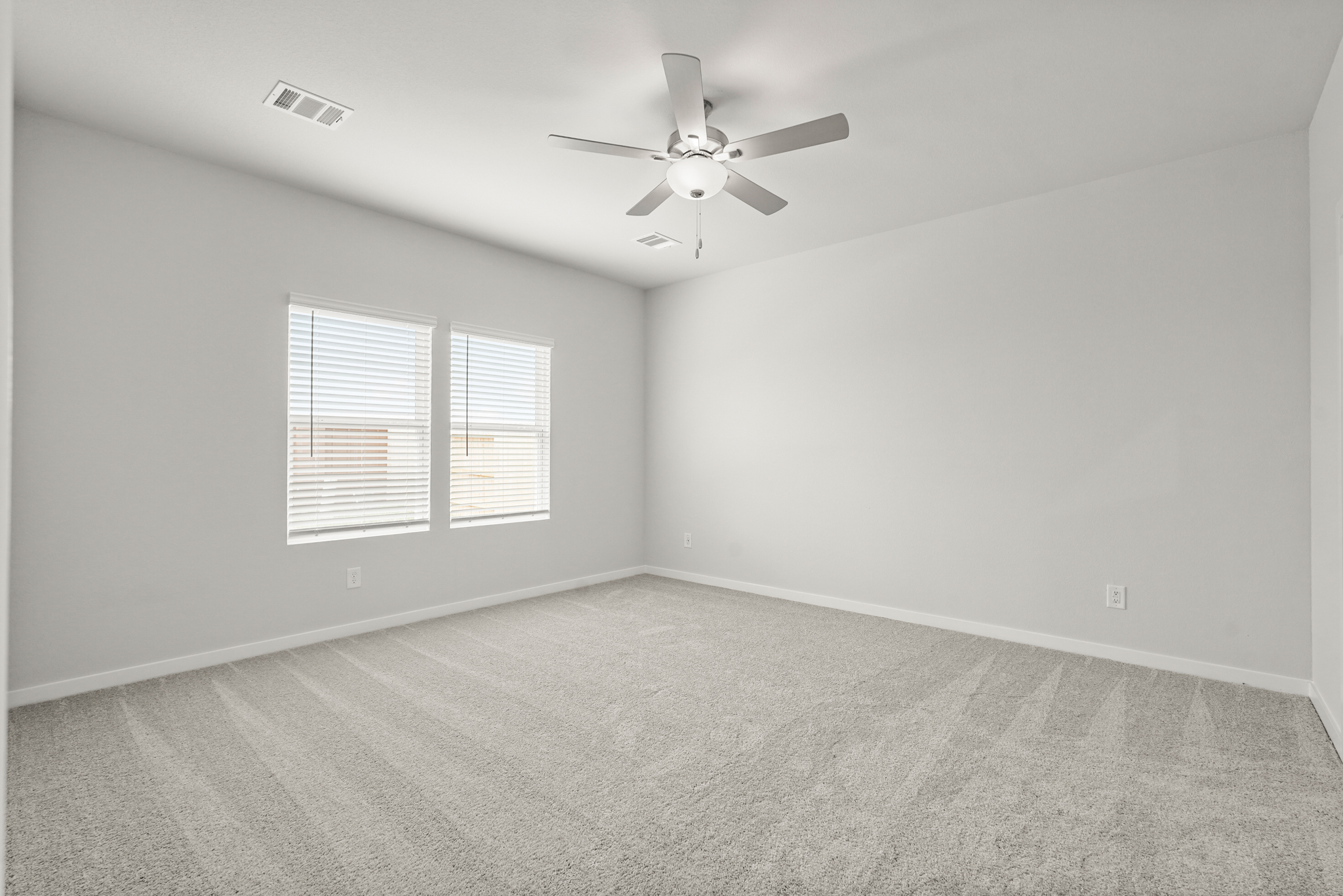 A ceiling fan in a room.