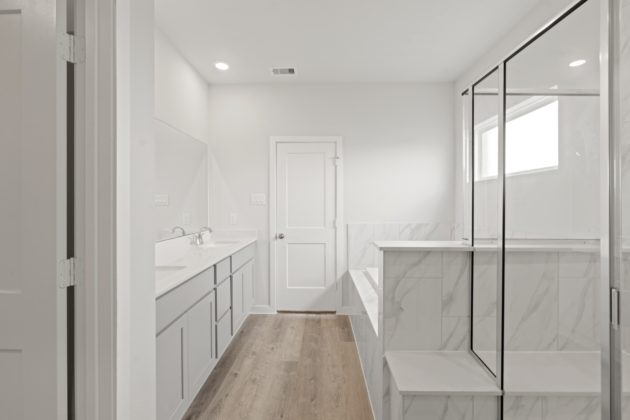 A bathroom with a glass shower.