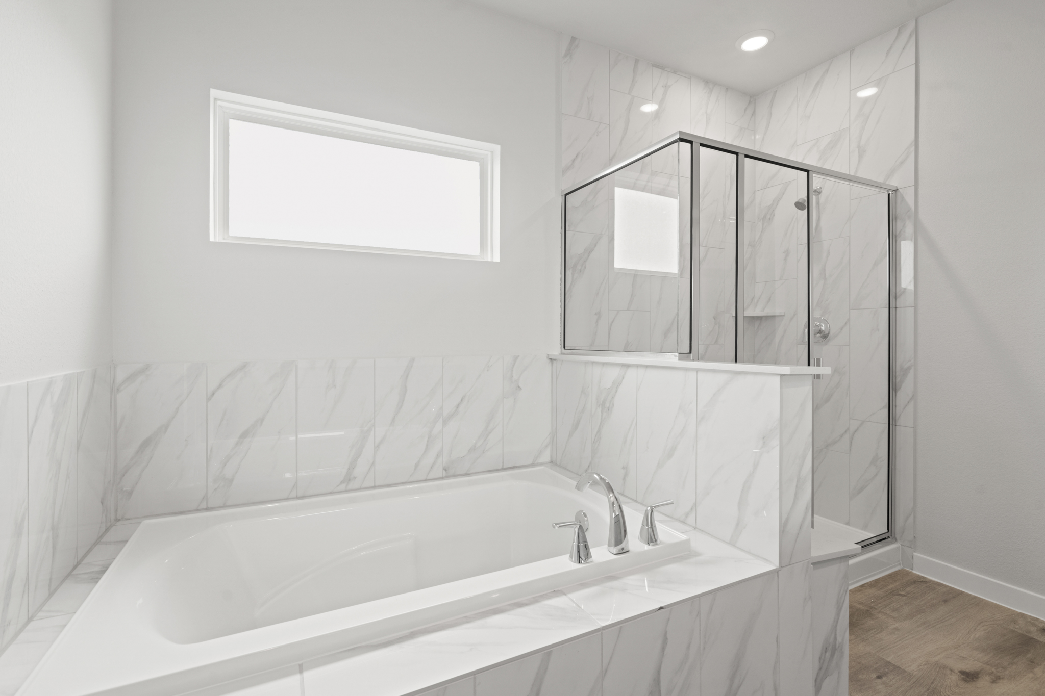 A bathroom with a glass shower.