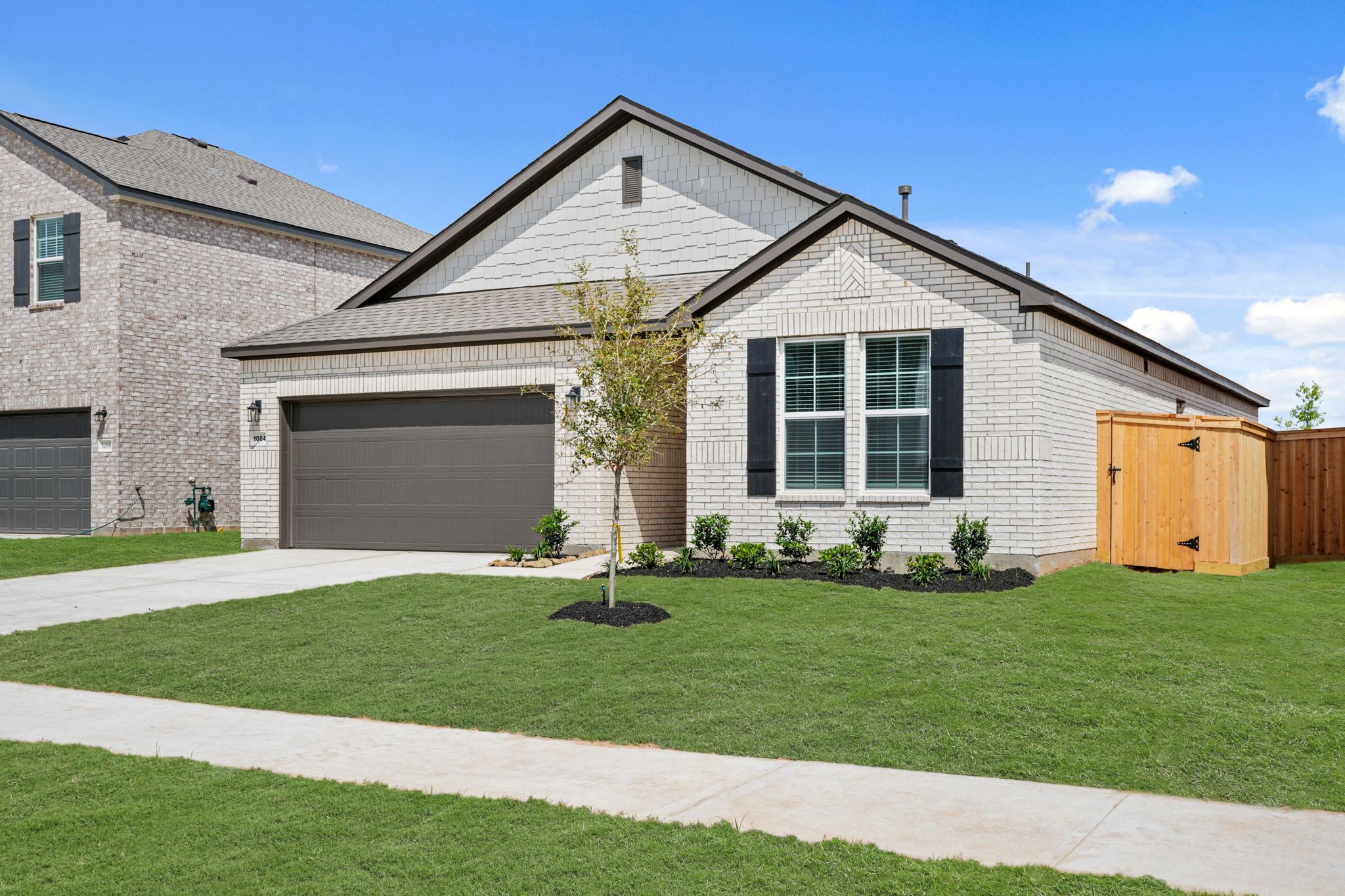 A house with a large front yard.