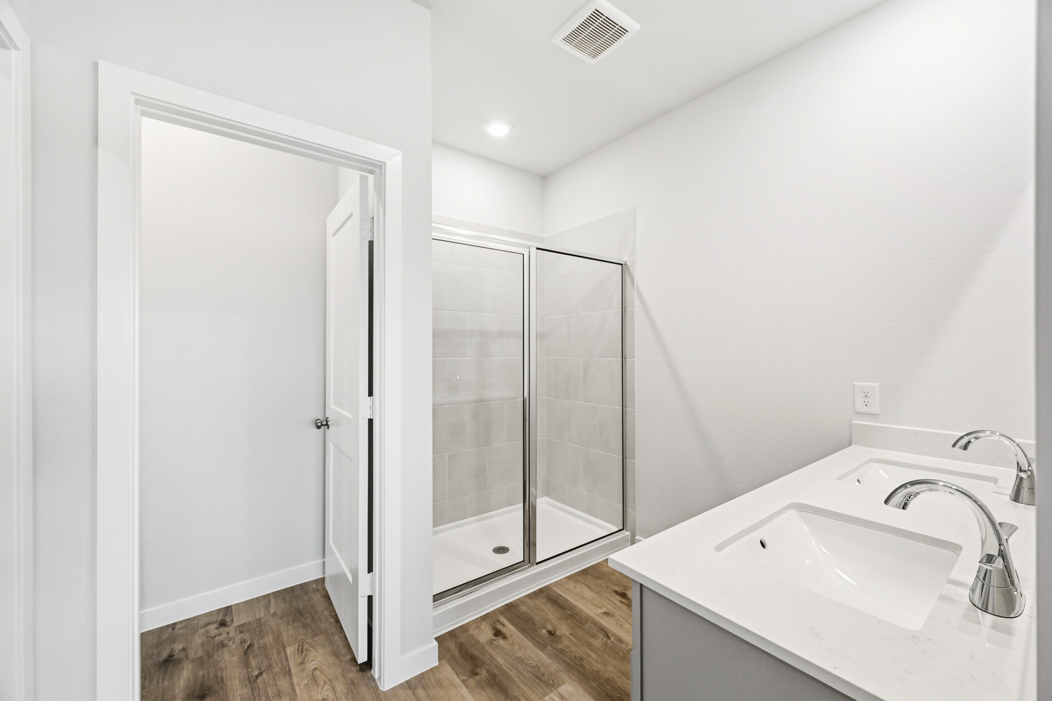 A bathroom with a glass shower.