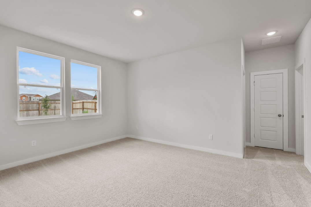 A room with a window and a door.