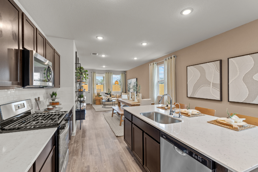 A kitchen with black cabinets.