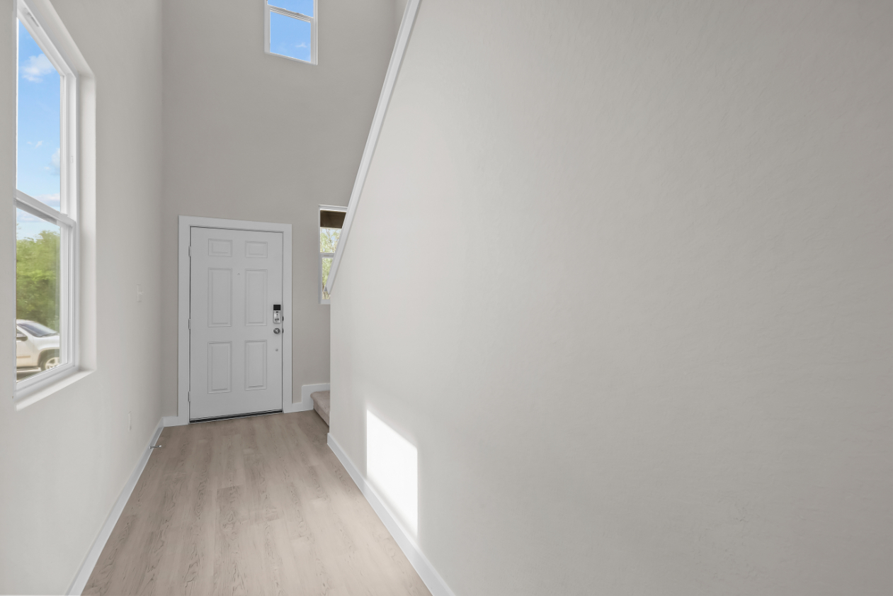 A room with a white door and a white door.
