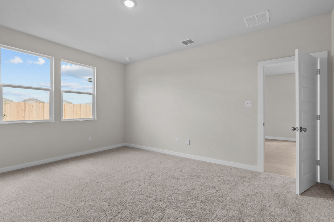 A room with a window and a door.