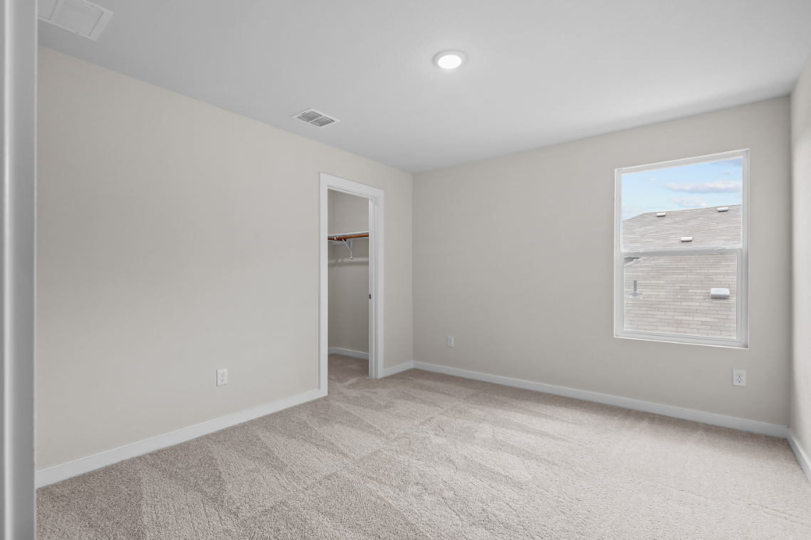 A room with a door and a window.