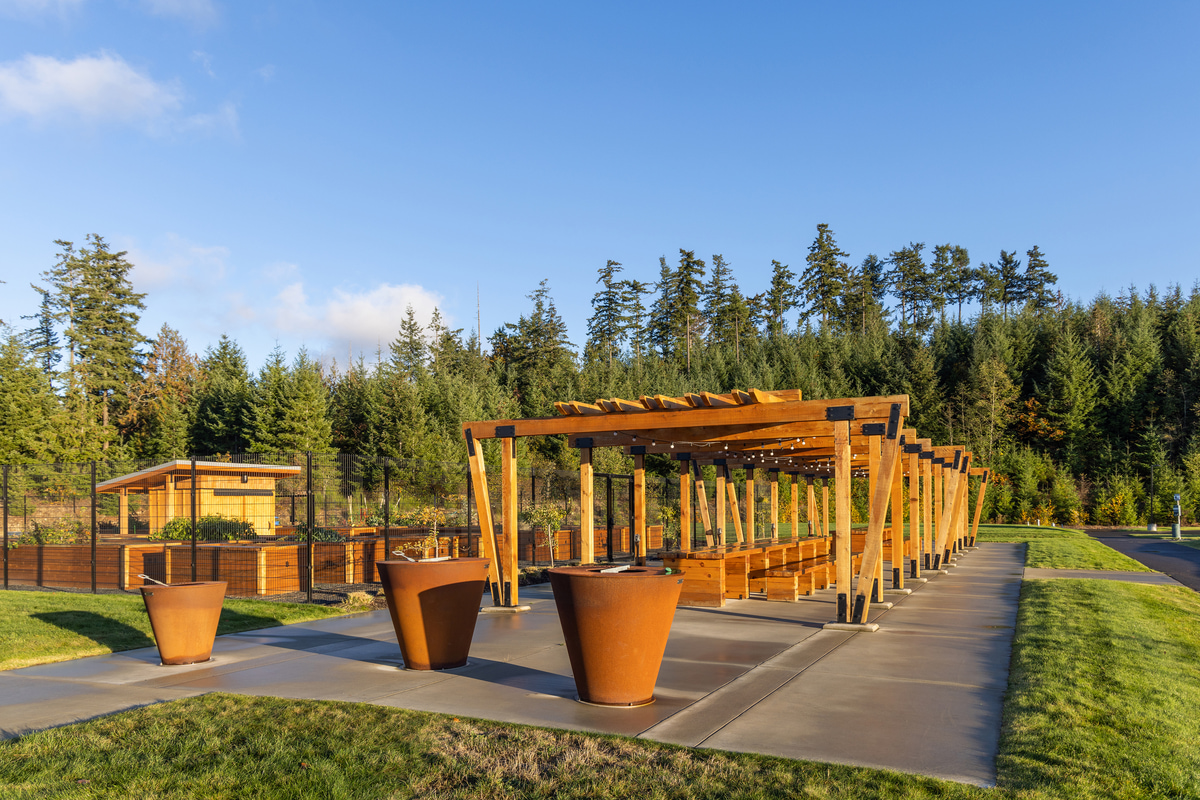 A wood structure with trees in the background.