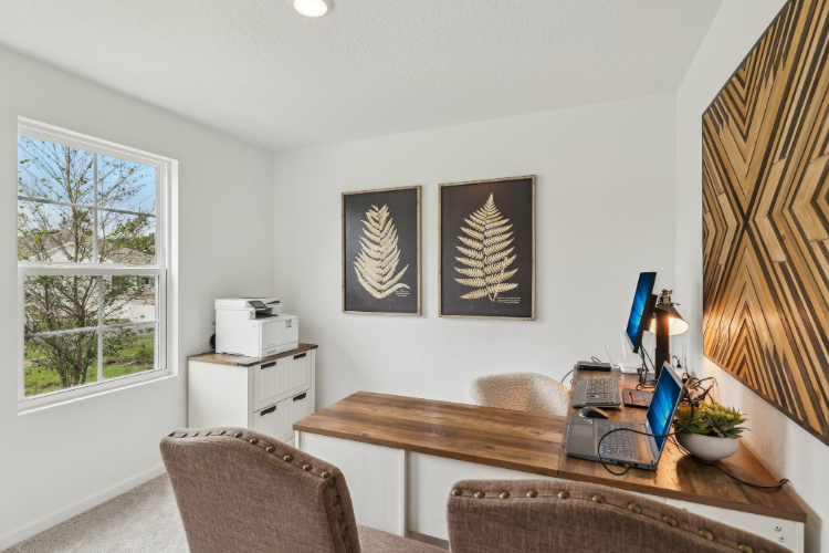 A room with a table and chairs.