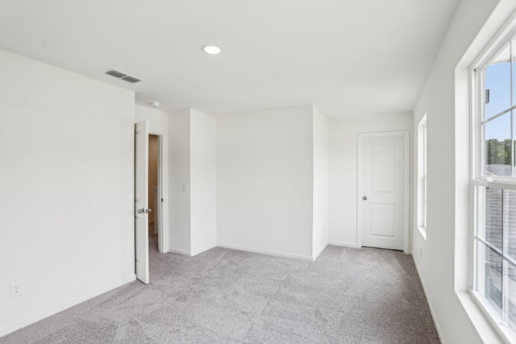 A hallway with white doors.