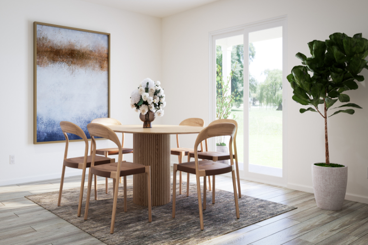 A dining room table with chairs and a plant in a pot.