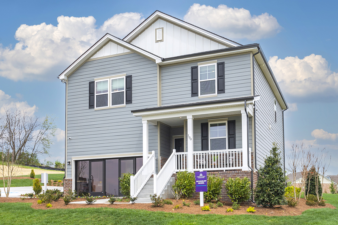 A house with a sign in front.