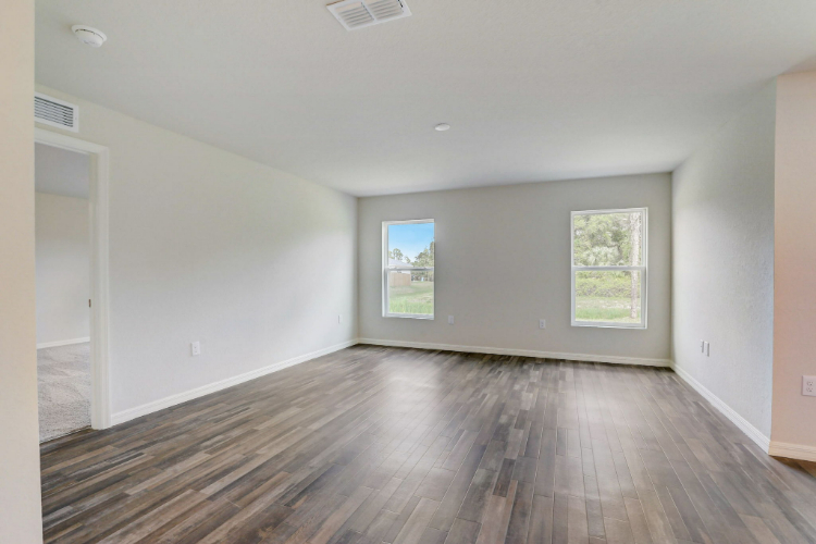 A room with a wood floor and a wood floor.
