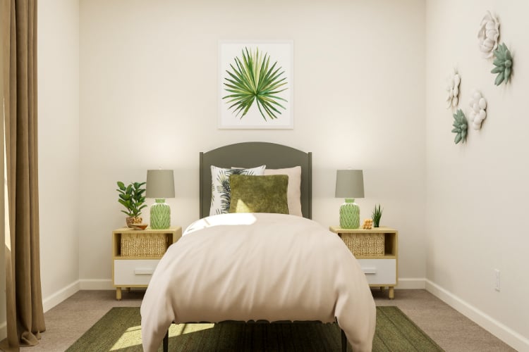 A bedroom with a bed and lamps.