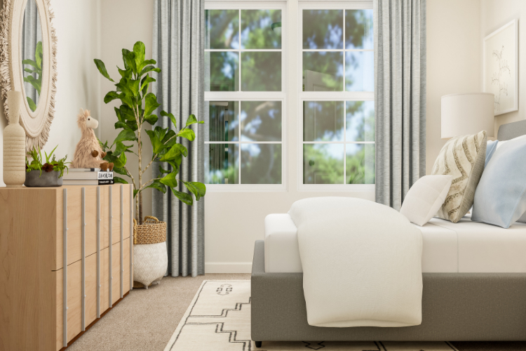 A living room with a white couch and a white chair.
