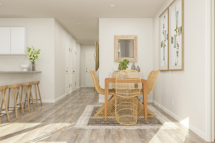 A dining room with a table and chairs.