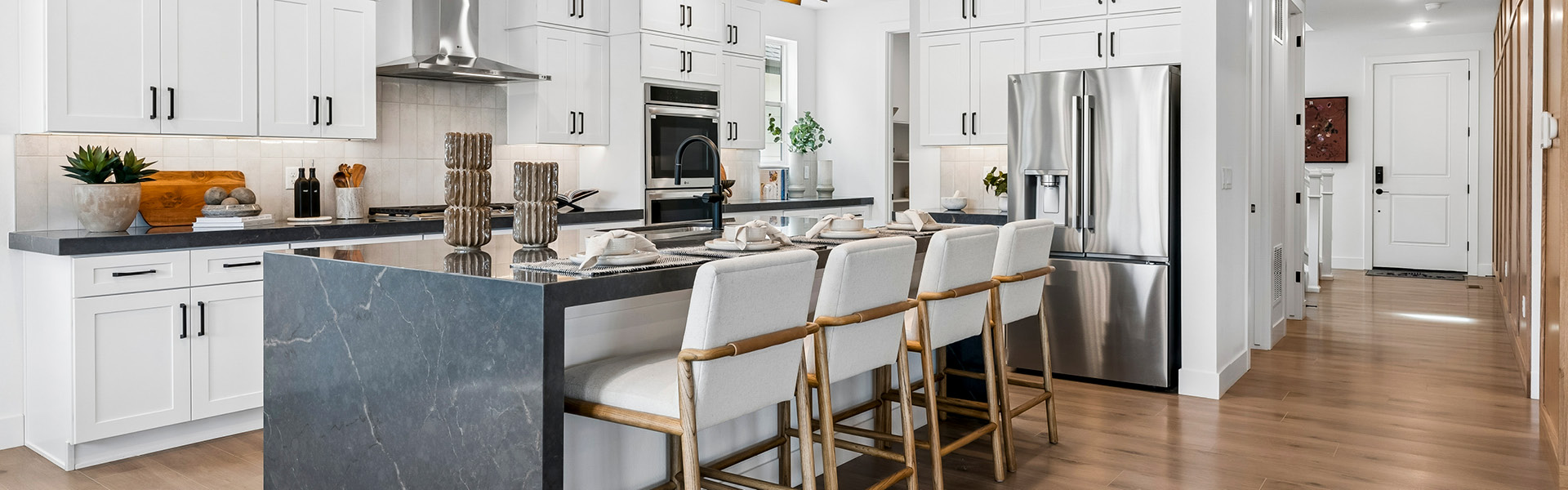 Century Communities kitchen with center island and white cabinets