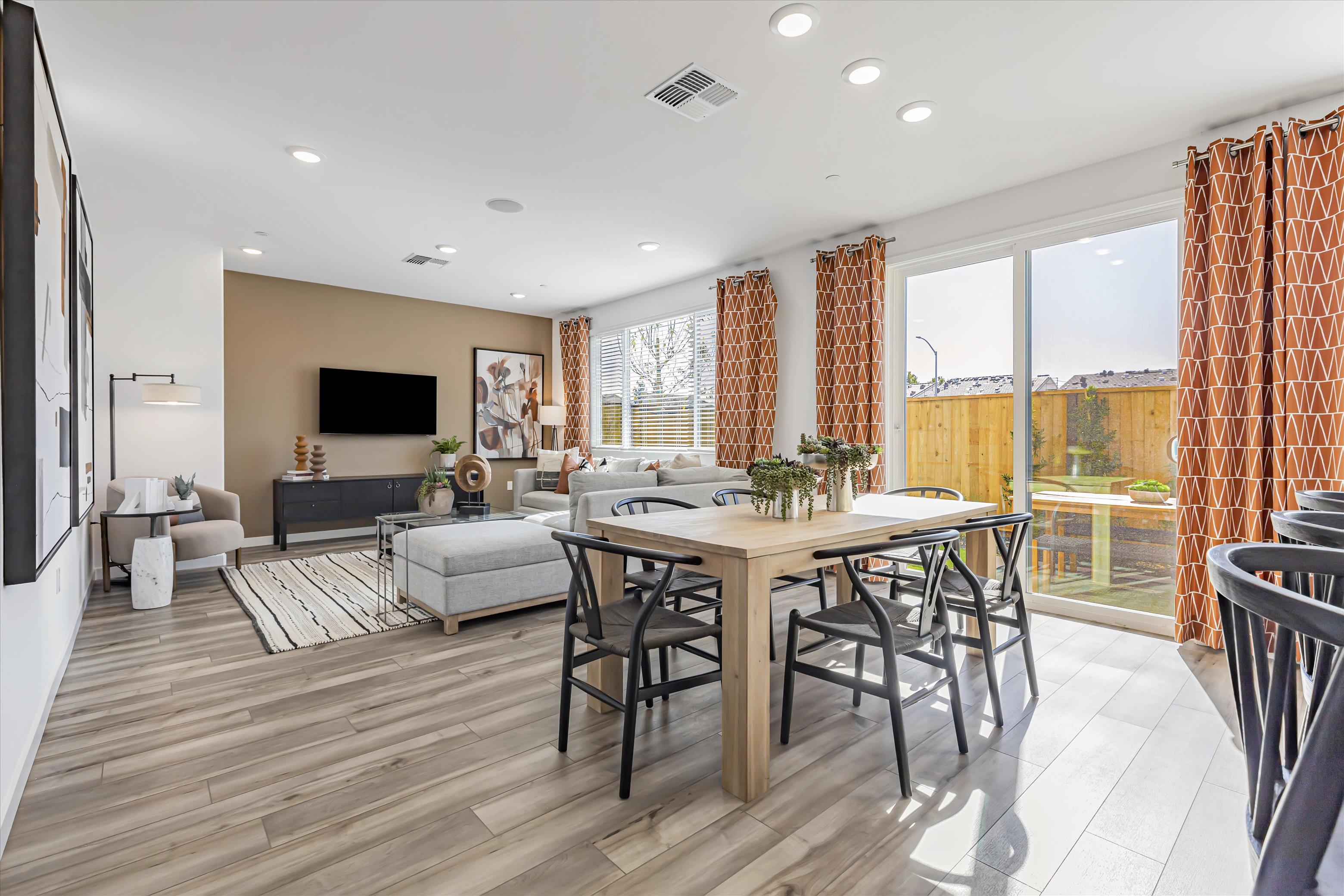 A large living room with a large window.